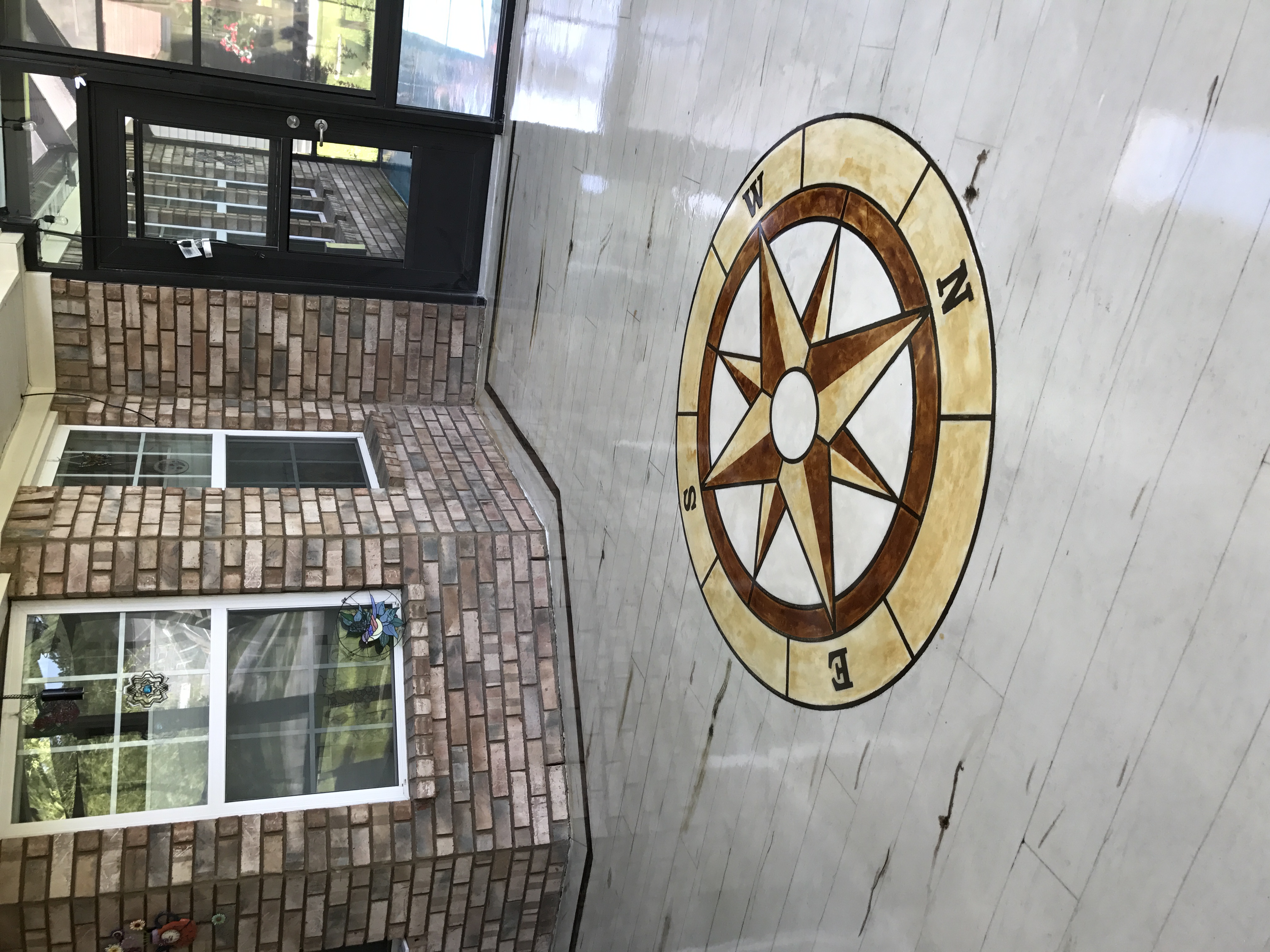 Marble epoxy with compass rose design in commercial lobby Hinesville GA