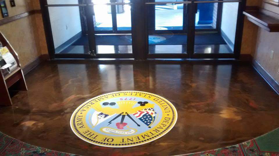 Metallic epoxy with custom Army seal in commercial lobby near Fort Stewart