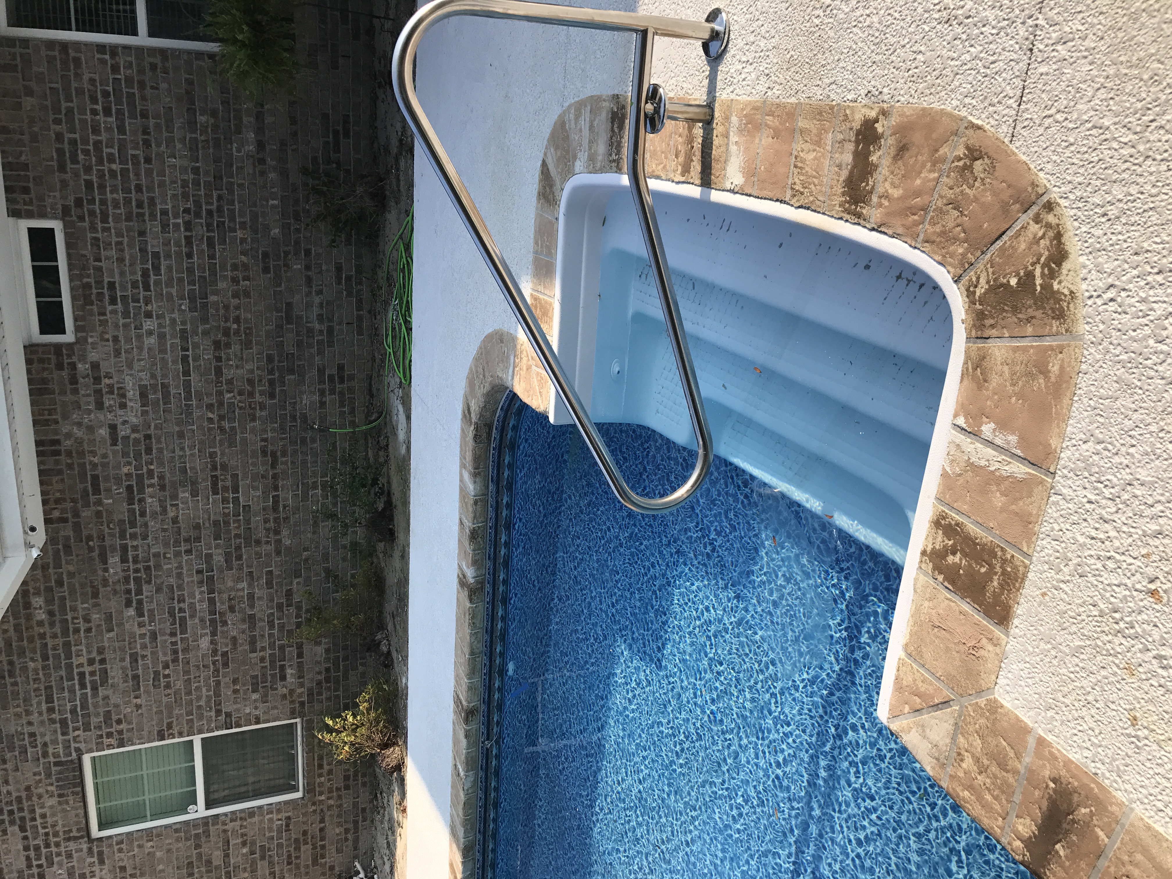 Pool deck with decorative stone concrete coating Hinesville GA